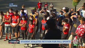 Student-athletes march to Washington state capitol for fall sports