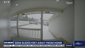 Semi narrowly misses home