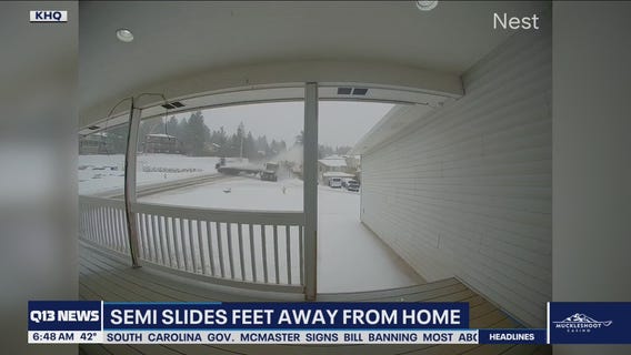 Semi narrowly misses home