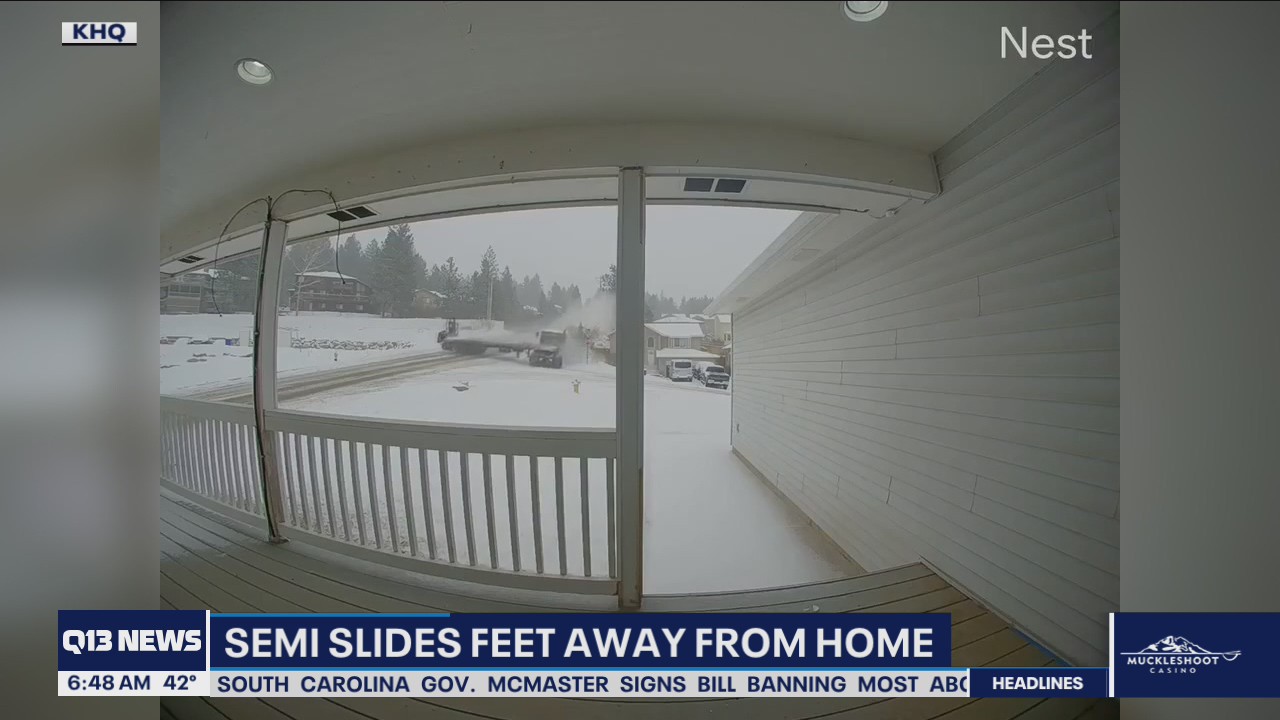 Semi narrowly misses home