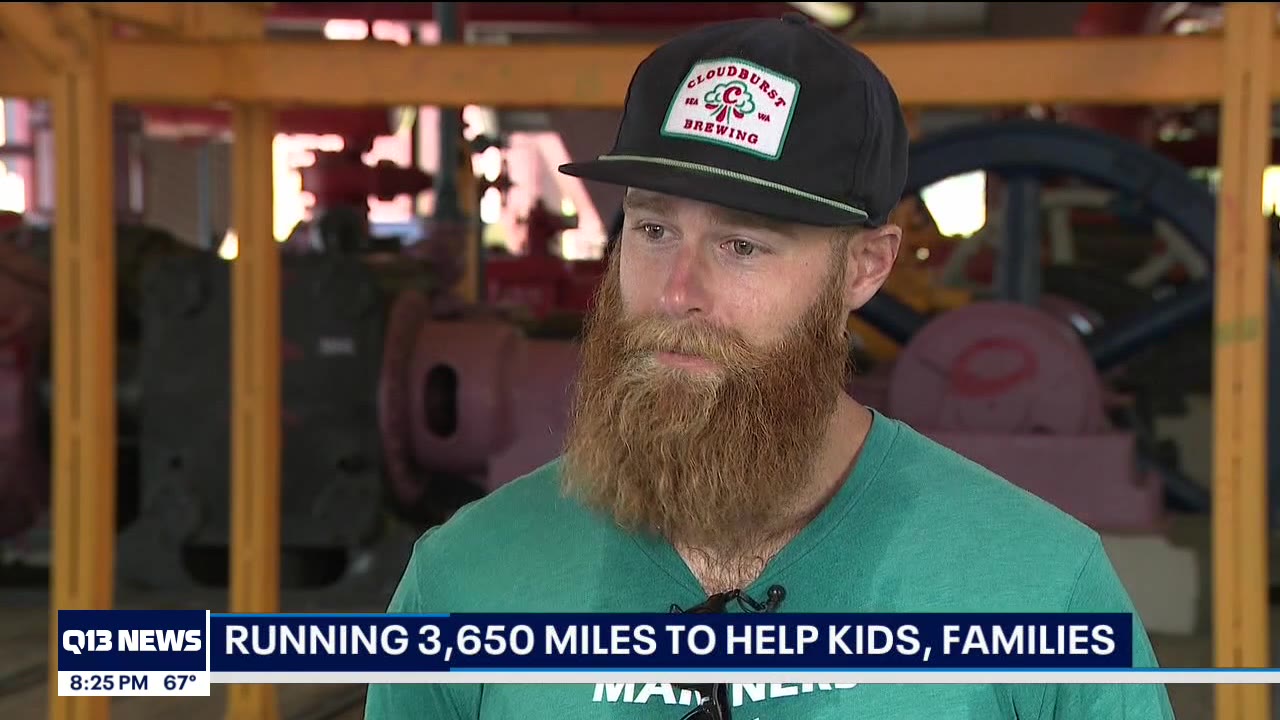 Mariners staffer helps raise money for families in need, one mile at a time