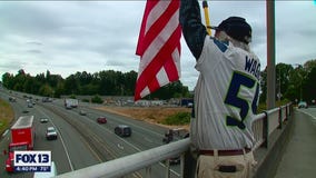 'Don't ever give up on you:' Vietnam veteran stands on overpass with message of suicide prevention