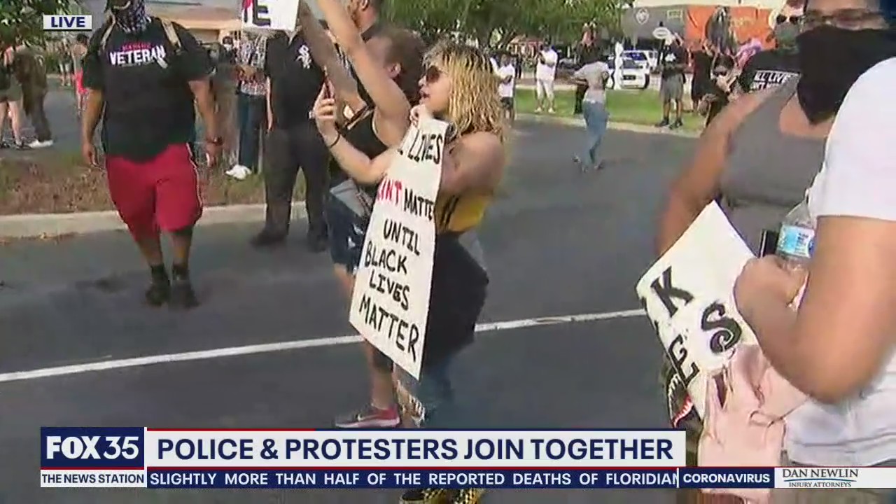 Police join protesters for Kissimmee march