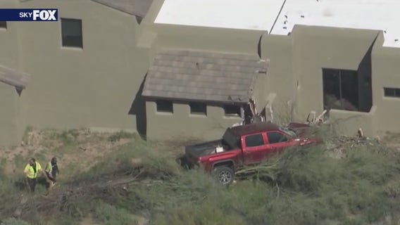 Truck crashes into Scottsdale home, 2 hurt