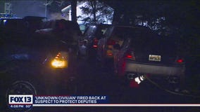 'Unknown civilian' fired back at suspect to protect police officers from further injury