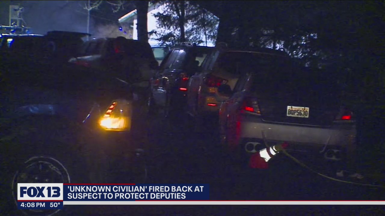 'Unknown civilian' fired back at suspect to protect police officers from further injury