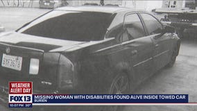 Missing woman rescued from towed car after 9 days was 'covered by clothing,' manager says