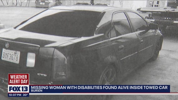 Missing woman rescued from towed car after 9 days was 'covered by clothing,' manager says