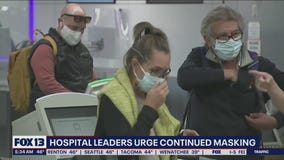 Hospital leaders urge continued masking