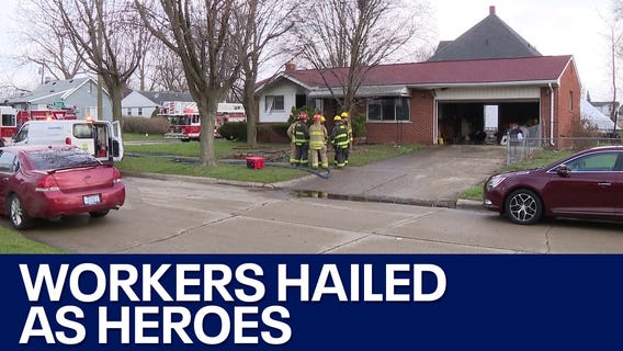 Woman saved from fire by sanitation workers