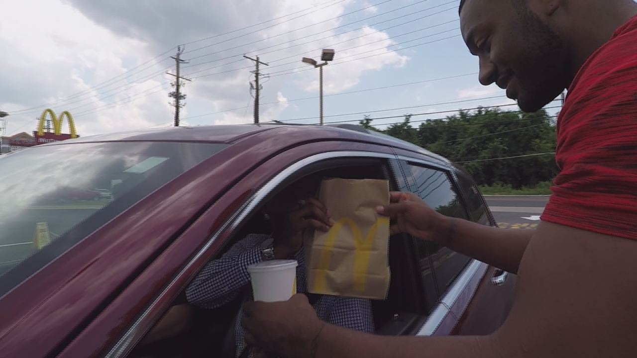 John Wall delivers food orders to McDonald's customers