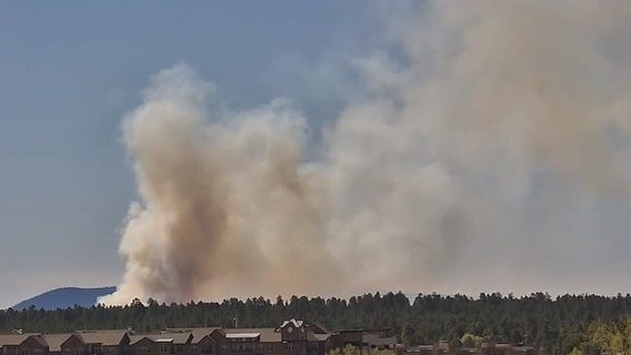 Prescribed fire burning near Flagstaff Airport