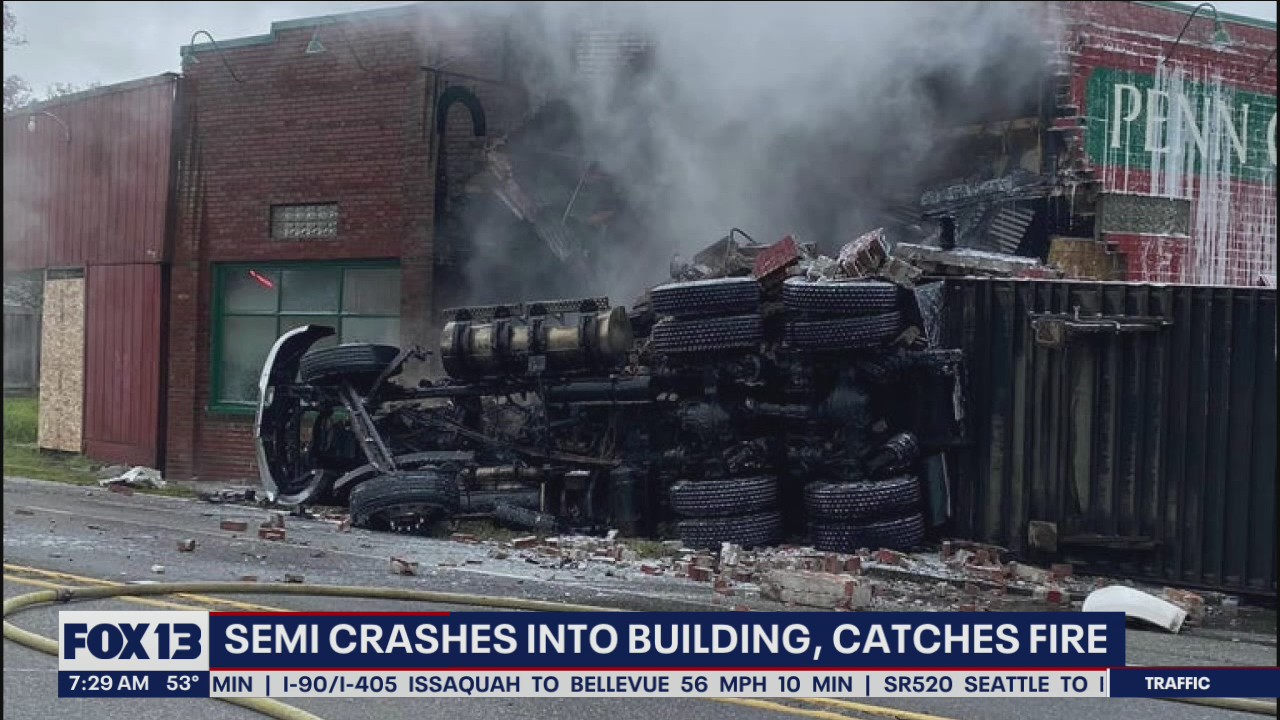 Semi crashes into building, catches fire near Port Orchard