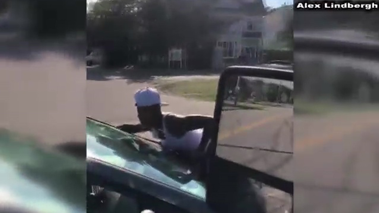 Woman clings to moving car in Virginia