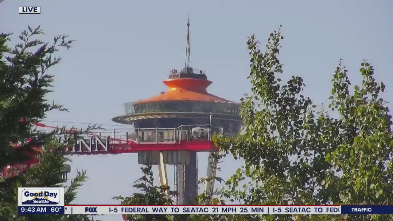 Abby Acone atop Space Needle previewing 'Base 2 Space'