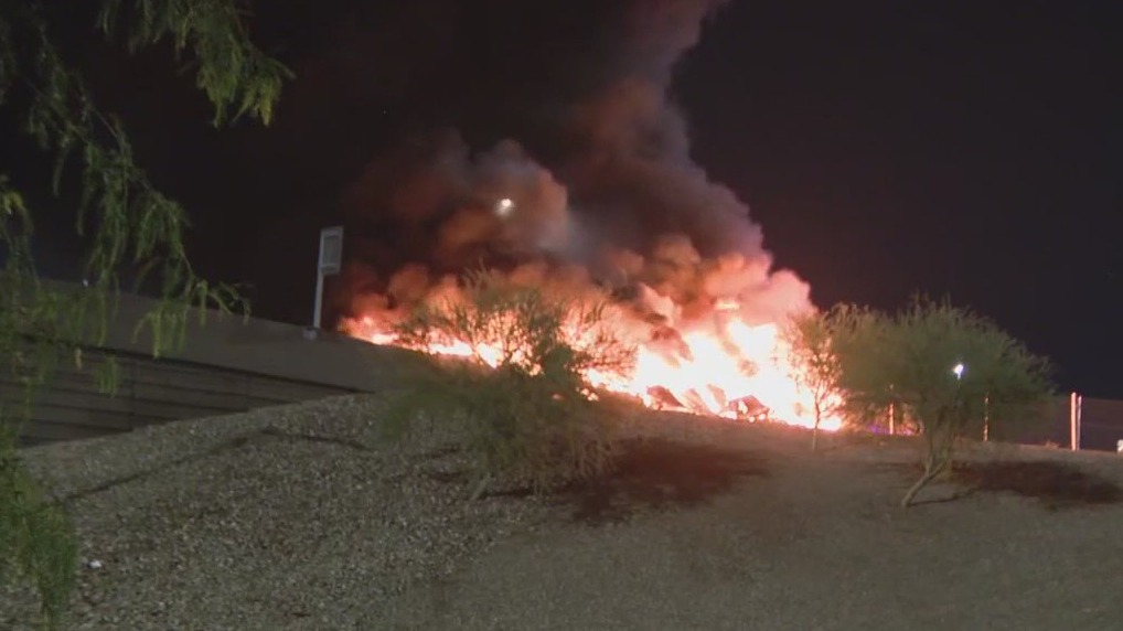 Tractor-trailer bursts into flames on freeway ramp