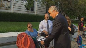 Sen. Bob Casey hands out pizza to protesters against repeal of Obamacare