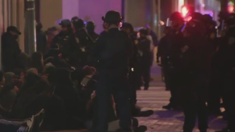 SF Police confront a splinter group of protestors after hours-long march