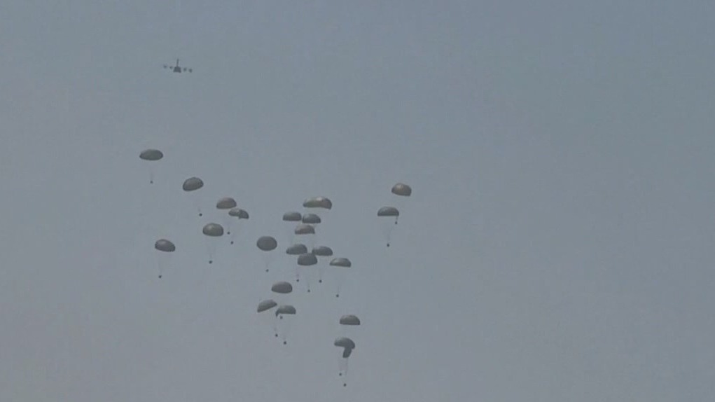 Military planes drop aid into Gaza as hunger crisis grows