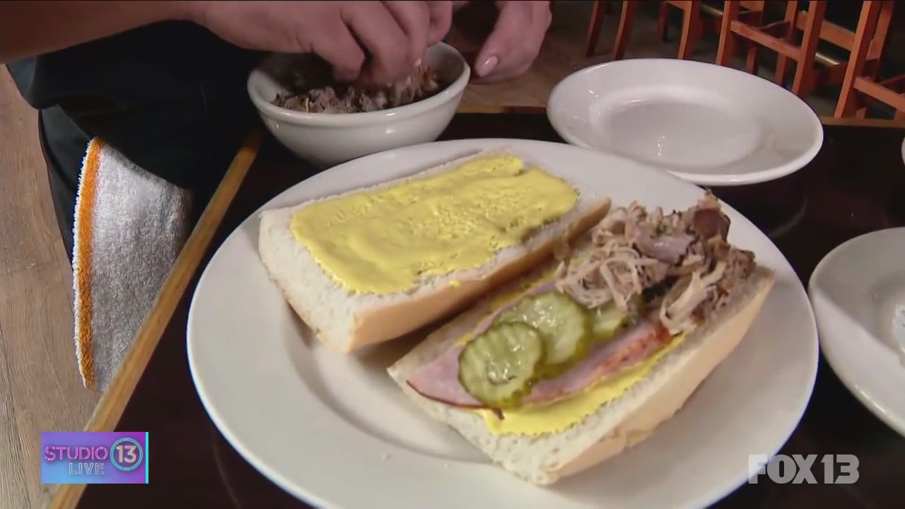Learning how to make the perfect Cubano Sandwich at Tides Tavern