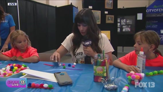Doing crafts with kids at the King County Fair