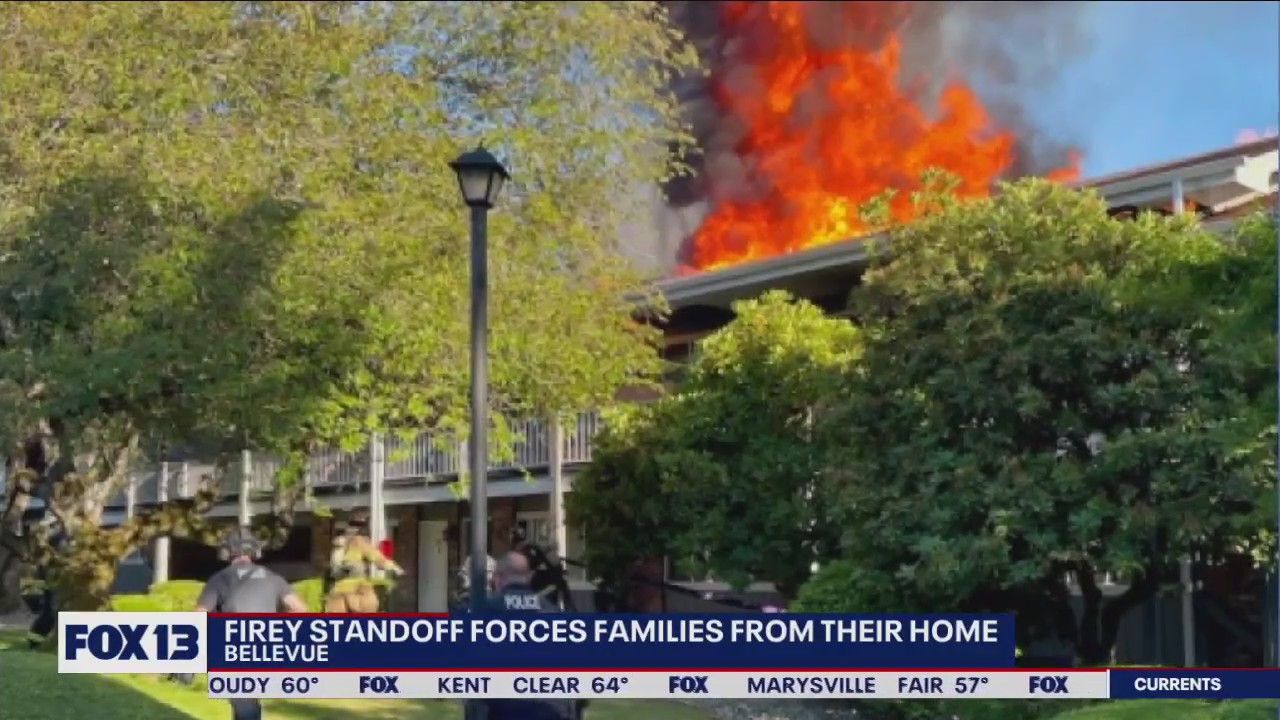Fiery standoff forces families from their home