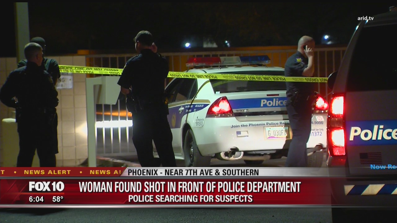 Woman found shot outside police station