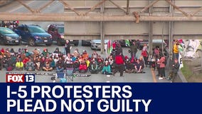 6 people charged in I-5 takeover plead not guilty
