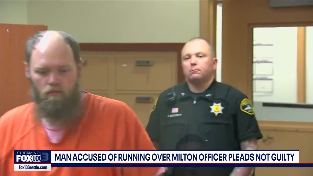 Man accused of running over Milton officer pleads not guilty | FOX 13 ...