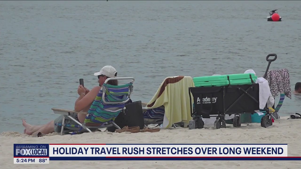 Holiday travel rush stretches over long weekend