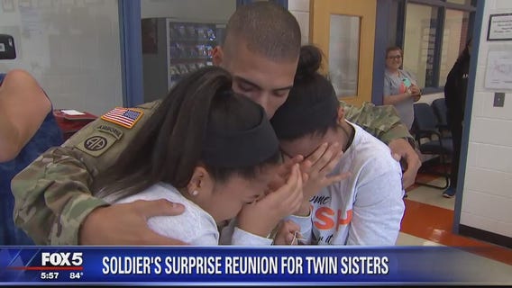 Soldier returns from Iraq to surprise twin sisters at Virginia high school