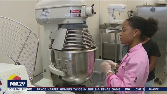Young Philadelphia baker selling product in grocery store pop-up event