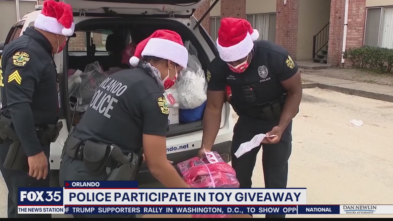 Orlando police officers participate in toy giveaway