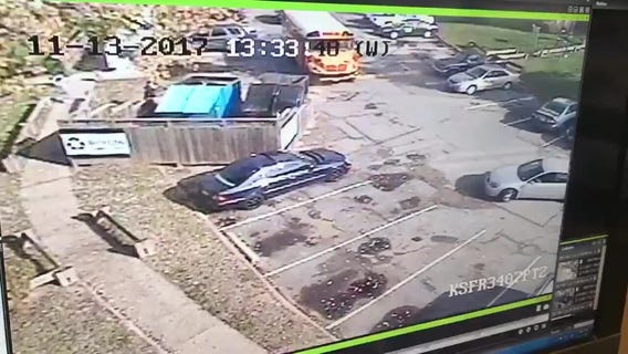 Police investigating after car goes into building and drives away