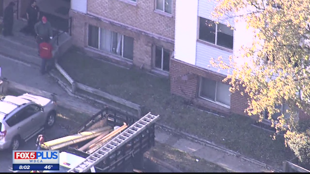 Police searching for driver who crashed into apartments and then fled scene