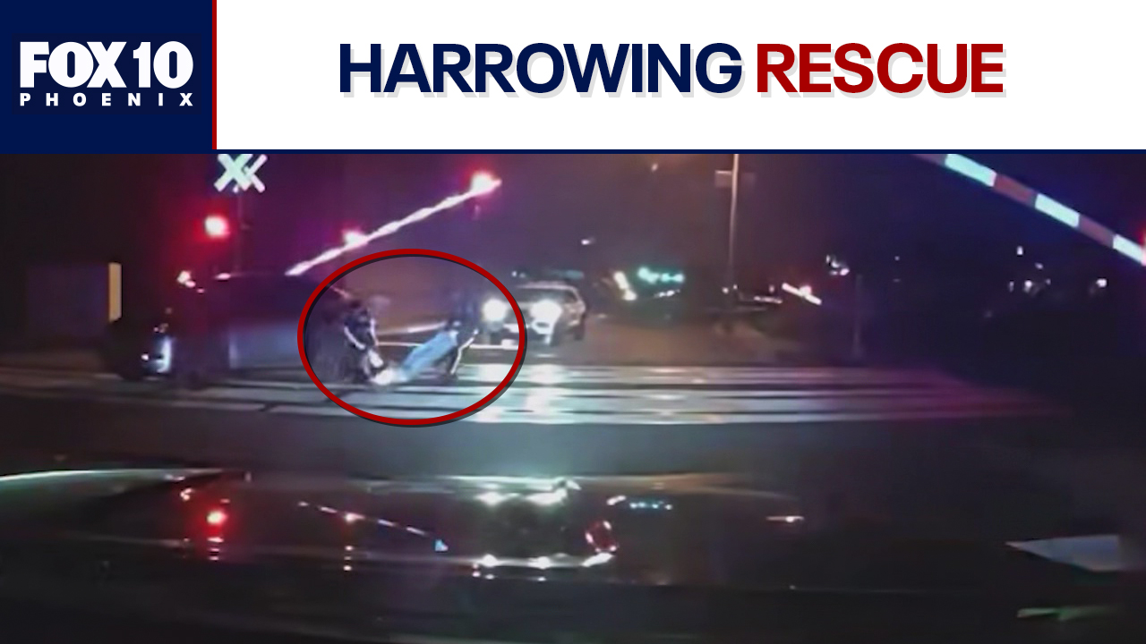 NJ officers rescue man stuck on train tracks | FOX 10 Phoenix
