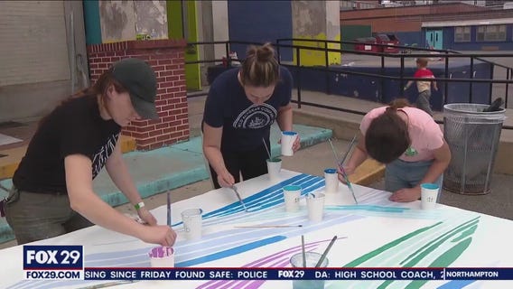 Fishtown students paint works of art, using school building as canvas