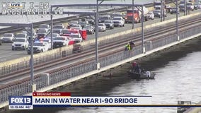 Man in water near Seattle I-90 Bridge