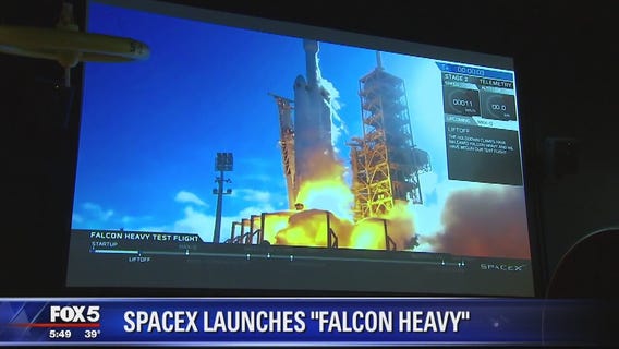 SpaceX's big new rocket blasts off, puts sports car in space