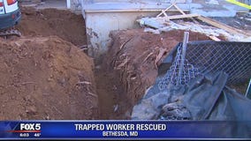 Worker rescued after being partially trapped in trench in Bethesda
