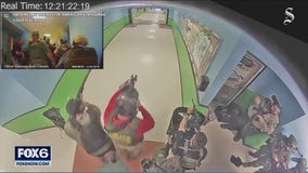 Video from inside Uvalde school shows officers milling around hallway during massacre
