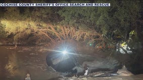 Woman dies after car is swept away in flash flood