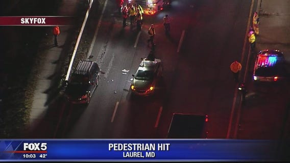 Man helping with vehicle disabled on roadway struck by another car in Laurel