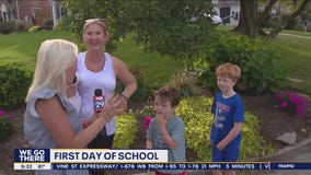Emotional goodbye at the bus stop for kids' first day of school