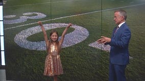 Savannah helps Rob Haswell with the weather