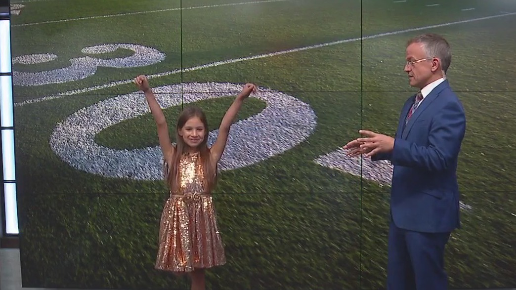 Savannah helps Rob Haswell with the weather