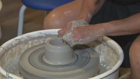 Molding clay on the wheel