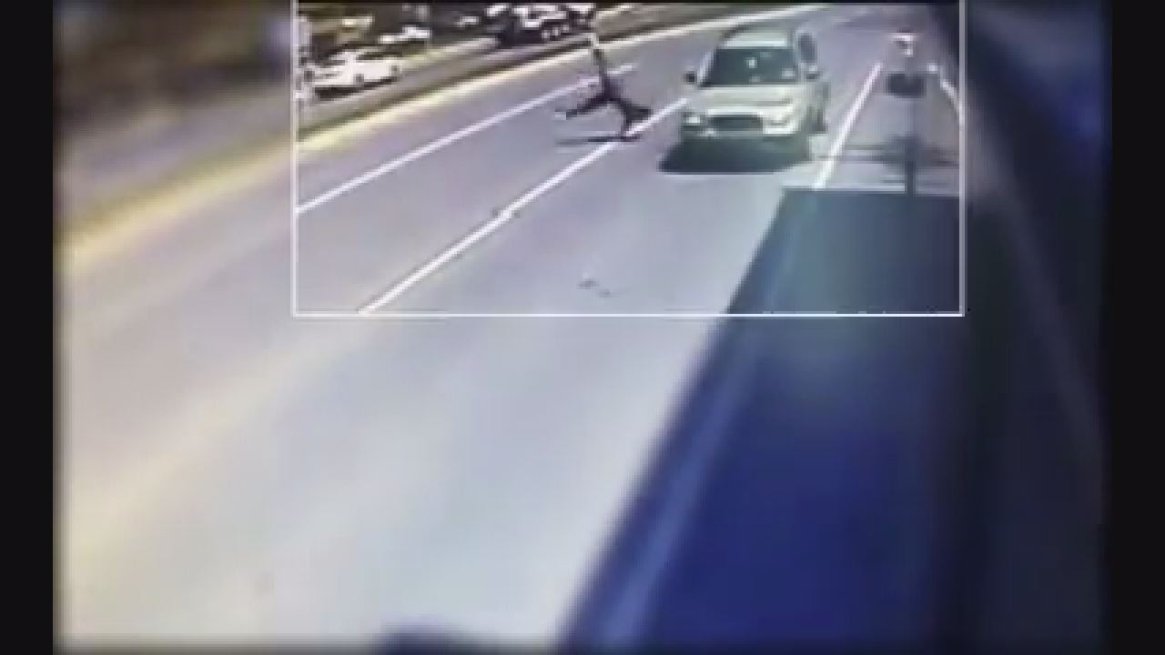 VIDEO: Suspect robs bus passenger, gets struck by car while fleeing the scene