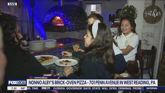 Checking out the menu at Nonno Alby's Brick-Oven Pizza