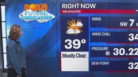 Aubrey helps Rob Haswell with the weather